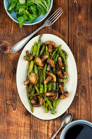 Baked asparagus spears with mushrooms.の写真素材