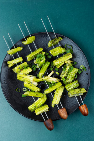 Vegetable celery skewers arrayed on a platter.の写真素材