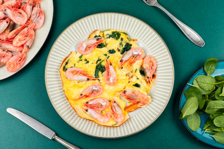 Egg with spinach and shrimps, omelette egg. Shrimp omelette with green.の写真素材
