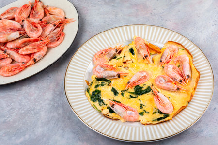 Tasty creamy omelet with shrimps or scrambled eggs and shrimps.の写真素材