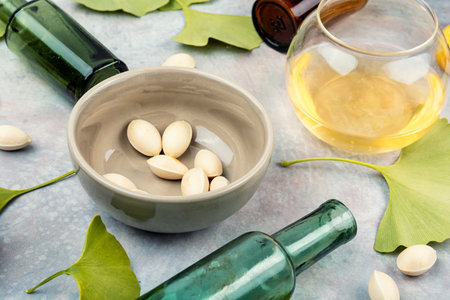 Healing herbal remedy using ginkgo biloba seeds and leaves.の写真素材