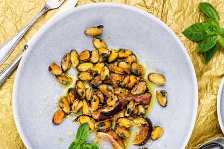 Delicious fried peeled mussels with figs, seafood, autumn recipe.の写真素材