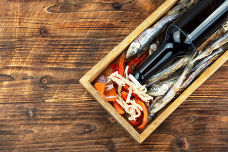 Dried salted smelt fish, dried salmon and dried squid. Space for text.の写真素材
