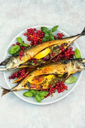 A plate of grilled fish, roasted mackerel fish with lemonの写真素材