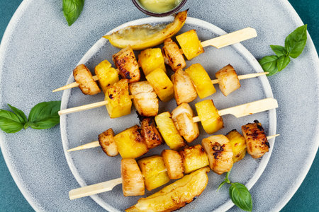 Sea scallops with pineapple on wooden skewers. Barbecue.の写真素材