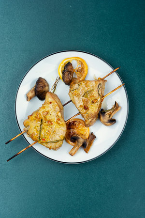 Tuna steak roasted with mushrooms on skewers. Seafood. Baked tuna.の写真素材