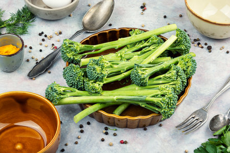 Baby broccoli stems with herbs and spices, ready for cooking. Healthy food conceptの写真素材