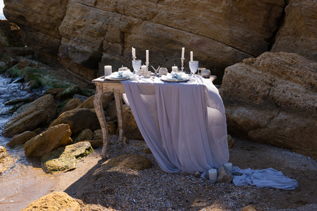 Wedding table decoration on a seashoreの写真素材