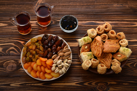 Turkish sweet baklava on plate with Turkish tea.の写真素材