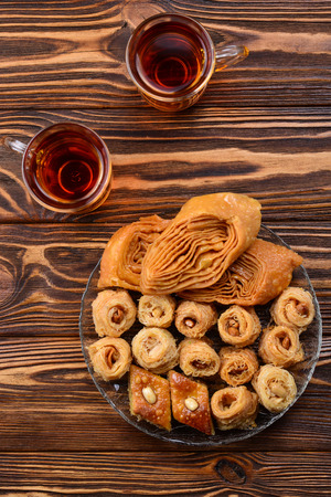 Turkish sweet baklava on plate with Turkish tea. の写真素材