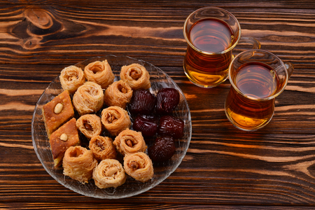 Turkish sweet baklava on plate with Turkish tea.の写真素材