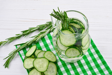 Cucumber and Rosemary Infused Water on wooden tableの写真素材