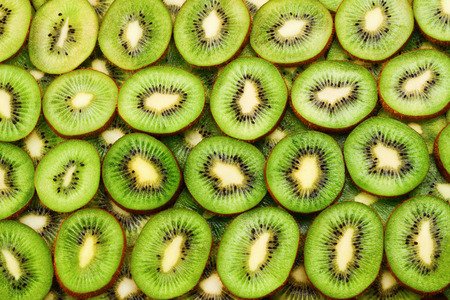 top view of heap of sliced kiwi as textured backgroundの写真素材