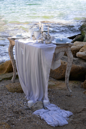 Wedding table decoration on a seashoreの写真素材