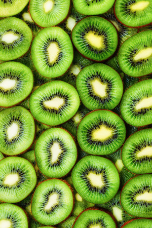 top view of heap of sliced kiwi as textured backgroundの写真素材