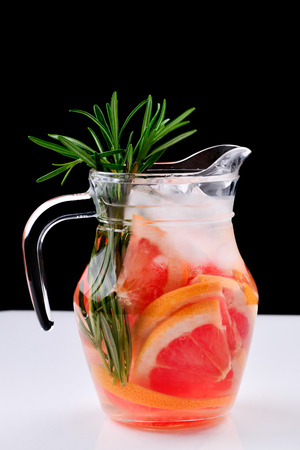 Refreshing summer detox cocktail of grapefruit and rosemary, on white background, copy spaceの写真素材