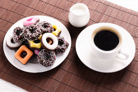 Coffee with milk and sweets and cookiesの写真素材