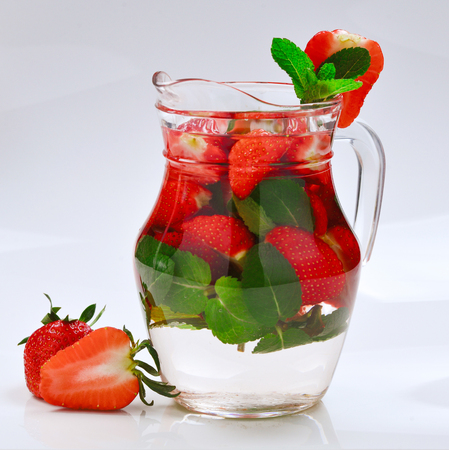 Summer fresh fruit flavored infused water of strawberry and mint. Space for test or design.の写真素材