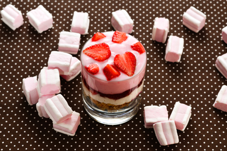 Muesli with yogurt and fresh  strawberry and marshmallow. Tasty dessert on breakfast. の写真素材