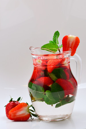Summer fresh fruit flavored infused water of strawberry and mint. Space for test or design.の写真素材