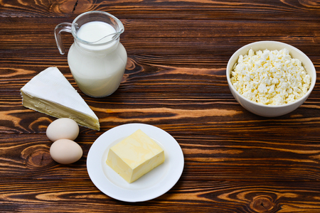 Set of fresh dairy products  on wooden background. Space for text o design.の写真素材