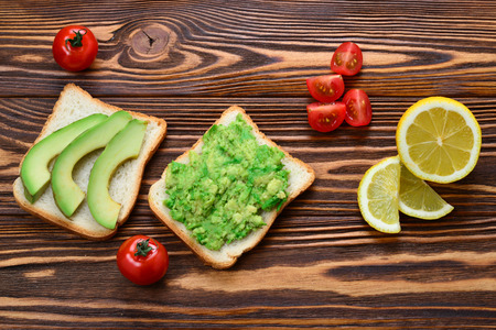 Avocado sandwich on a bread made with fresh sliced ??avocadosの写真素材