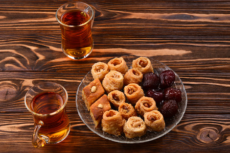 Tea with rahat and dried fruits on a wooden tableの写真素材