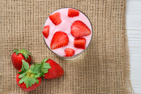 Home made granola breakfast with strawberries and plain yogurt, served in the glass.の写真素材