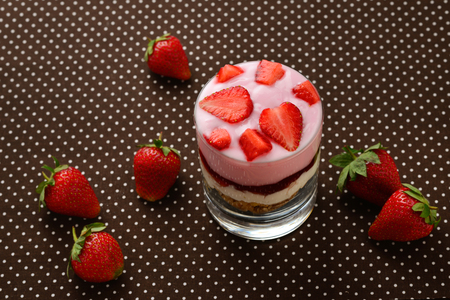 Home made granola breakfast with strawberries and plain yogurt, served in the glass.の写真素材