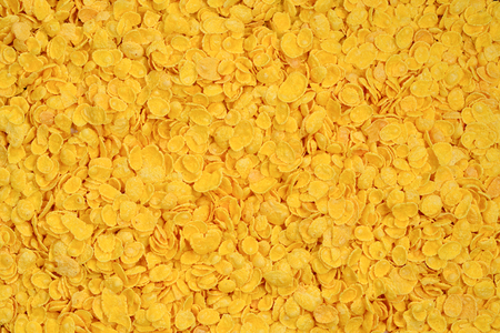 Corn-flakes background and texture. Top view. cornflake cereal box for morning breakfast.