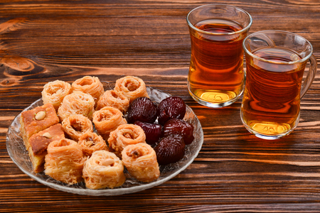 Tea with rahat and dried fruits on a wooden tableの写真素材