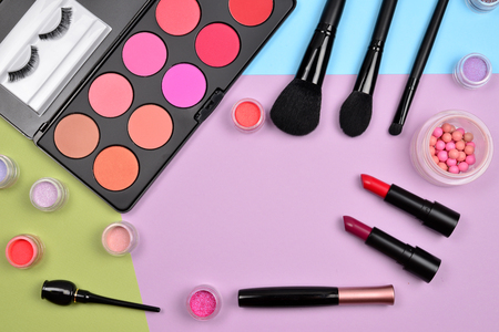 Professional makeup products with cosmetic beauty products, blushes, eye liner, eye lashes, brushes and tools.の写真素材