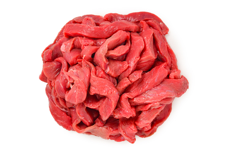 Raw veal pieces background.  Beef stroganoff.の写真素材