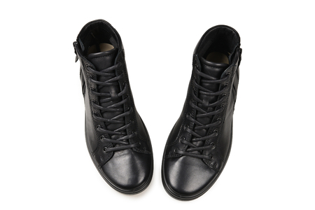 Men's black leather shoes and a black camera on a isolated on white background. Copy space.の写真素材