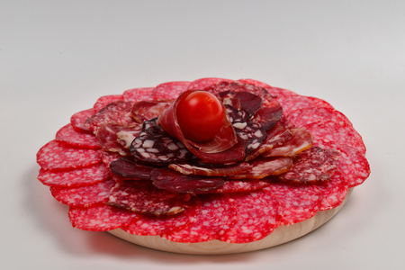 Different kinds of meat cuts on the boards. On a wooden background.の写真素材