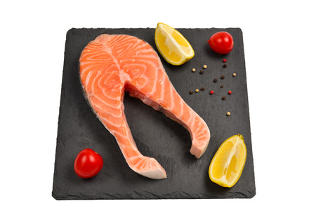 Raw salmon steak isolated on white.の写真素材