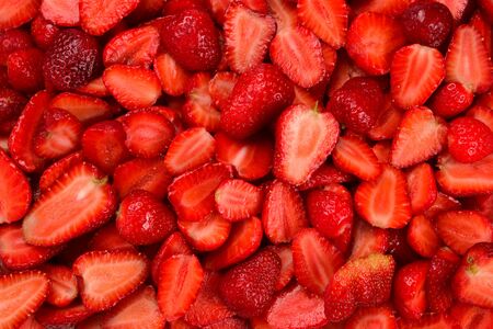 Strawberry slices. Fresh berries macro. Fruit background. Top view.の写真素材