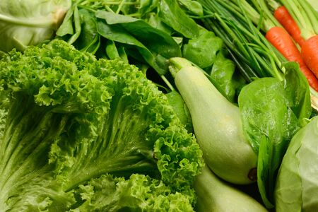 Fresh vegetables and herbs as a background.の写真素材