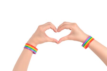 Close up of heart made by woman hands with pale skin isolated on white background. LGBT.の写真素材