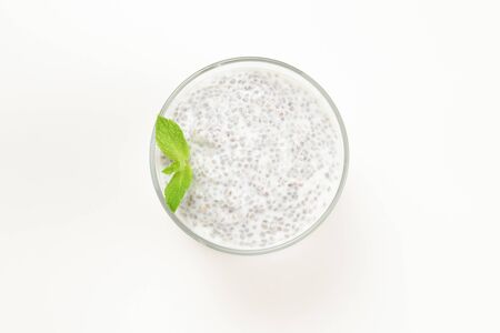 Chia pudding with mint on a white background. Space for text or design.の写真素材