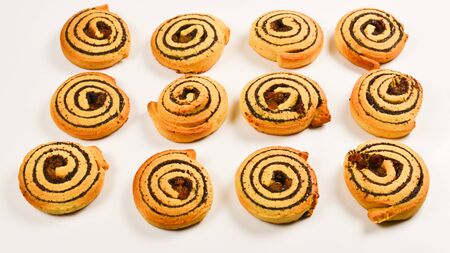Baked cookies with raisins and poppy seeds isolated on white background.の写真素材
