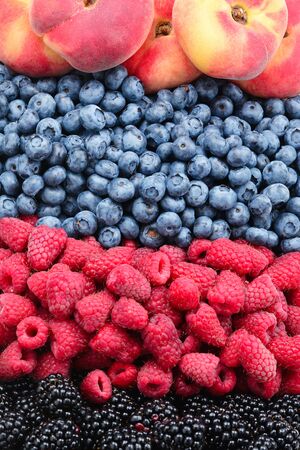 Blackberry, raspberry, blueberry, fig peach background.の写真素材