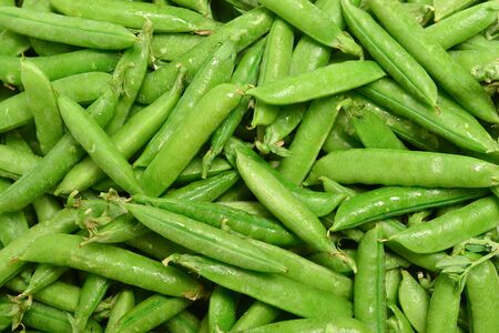 Fresh pea pods as background. Top view.の写真素材