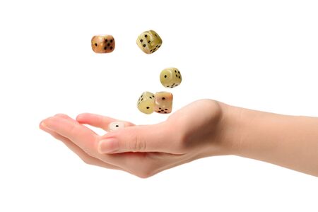 Woman throws dices isolated on white.の写真素材