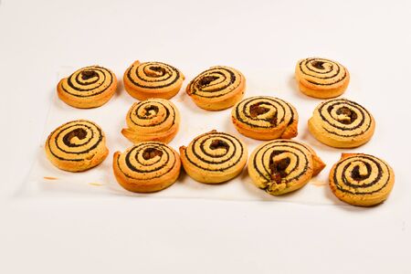 Baked cookies with raisins and poppy seeds isolated on white background.の写真素材