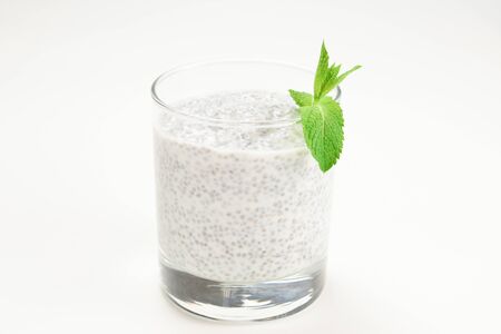 Chia pudding with mint on a white background. Space for text or design.の写真素材