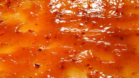 Orange sauce splashes as a background.の写真素材