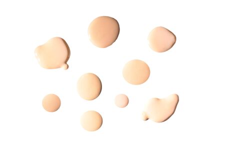 Liquid foundation swatch isolated on white background. Close Up of makeup cream sample.の写真素材
