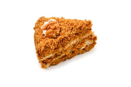 Peace of honey cake isolated on white background.の写真素材