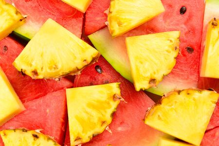 Pineapple and watermelon slices background.の写真素材